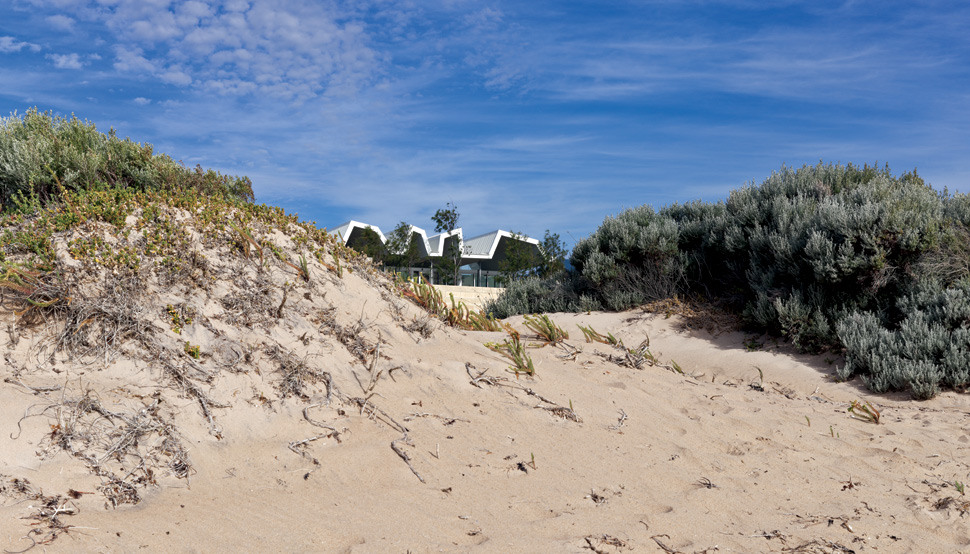 It's the striking form of this house that sets it apart from its milieu - especially the pitched and folding roof line that provides differing ceiling heights.